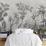 Papier Peint Jungle Tropical Noir Et Blanc Panoramique dans une chambre à coucher apaisante avec lit blanc, table de chevet moderne, et plantes vertes. Illustration d'un paysage tropical dense avec une variété de plantes tropicales comme des palmiers, des fougères, et des plantes à larges feuilles.